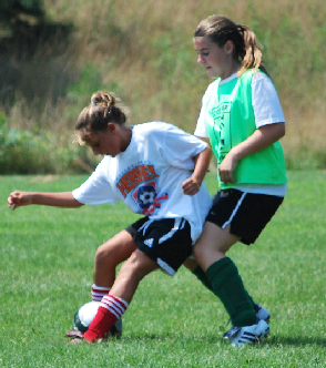 girls blocking ball